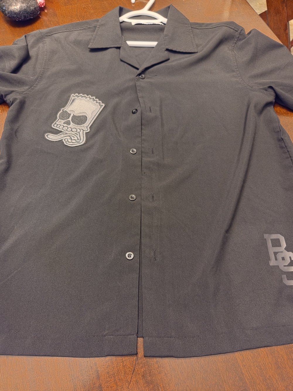 Men's Black Short-Sleeve Button-Down Shirt with Skull Patch